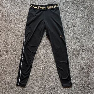 Nike Pro Leggings in Black with Gold Details